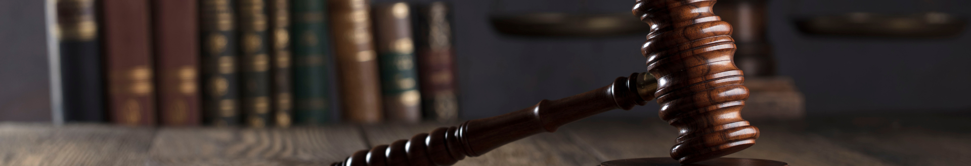 gavel with books in the background