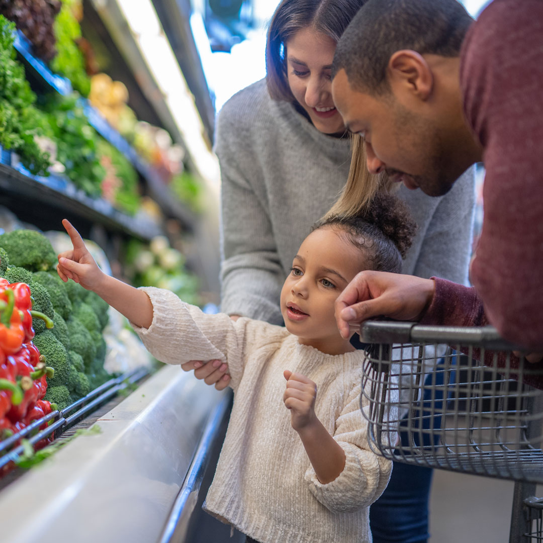 Family picking vegetables (WIC)